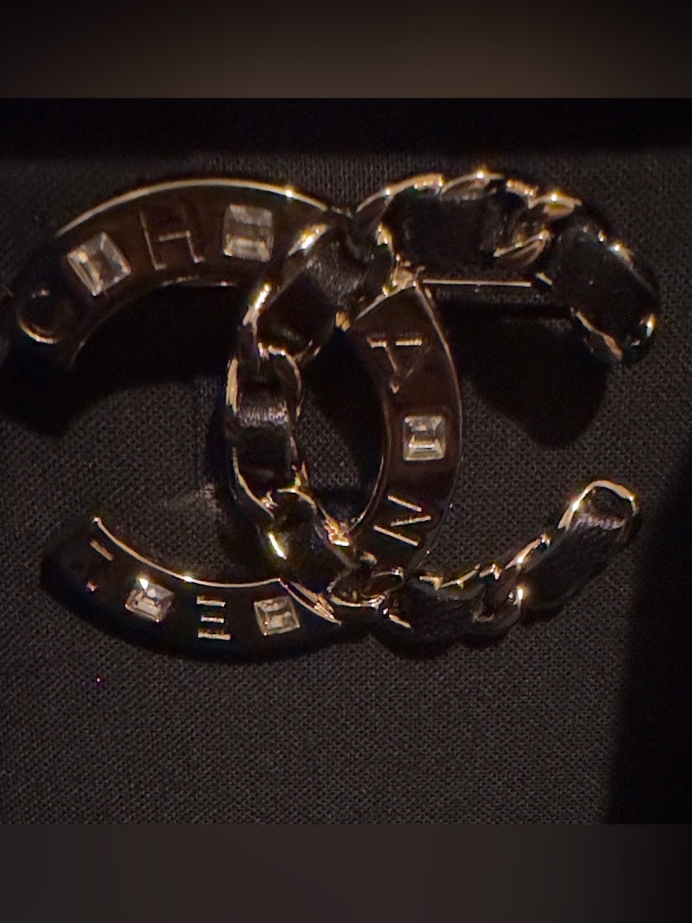 LIKE NEW CHANEL Gold and Black Interlocking CC Logo Brooch. 19S Collection.